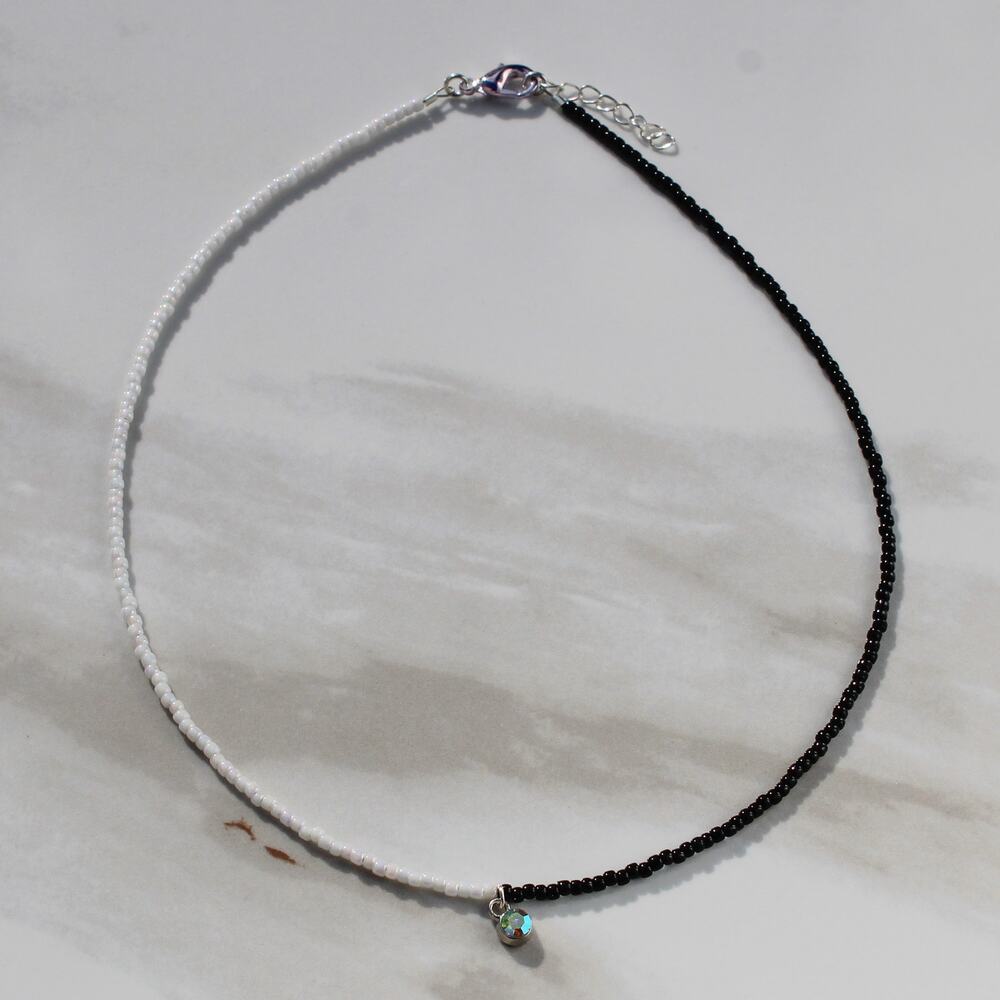 Black and White Beaded Necklace with Tiny Charm